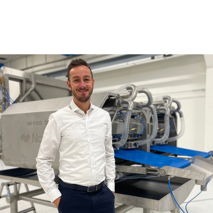 The new CCO Norbech, Peter Fredborg Nielsen, in front of a Norbech fish processing machine.
